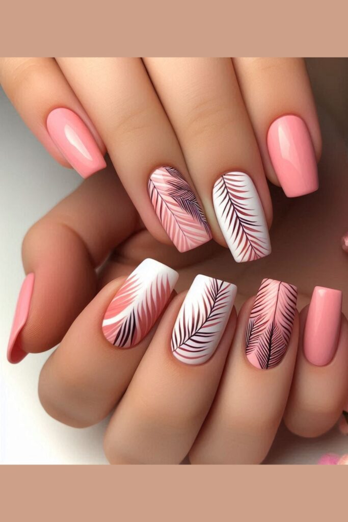 Nails painted with various shades of pink palm leaf designs over a white or light pink base, set in a tropical beach setting